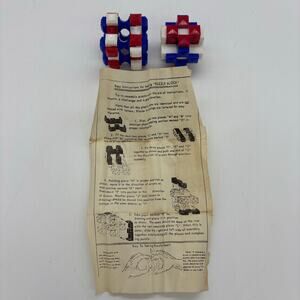 Vintage 2 mechanical blocks Burr puzzles with instructions.